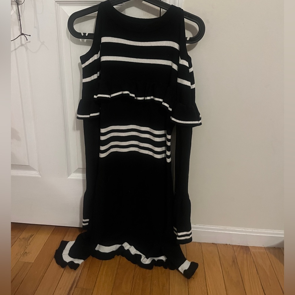 Black and white sweater dress with cut outs on the shoulders